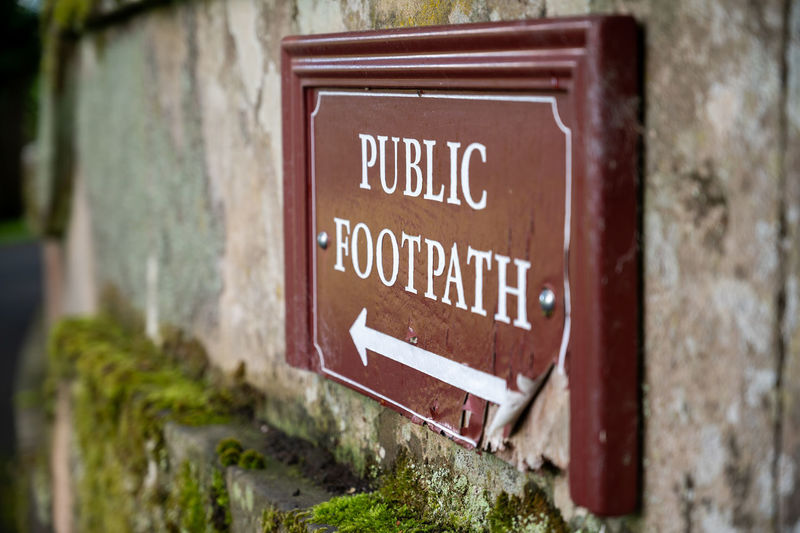 Close-up of sign on wall