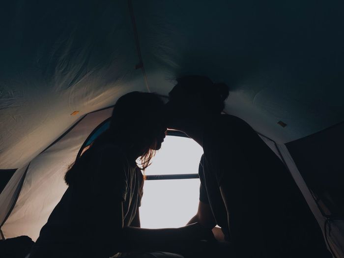 Couple sitting in tent