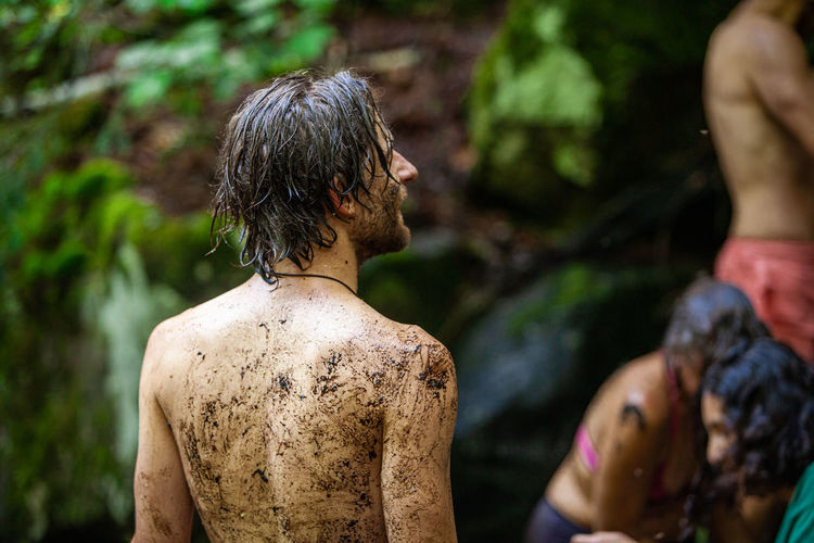 Rear view of man and woman in forest