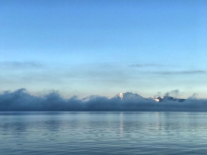 Scenic view of sea against blue sky