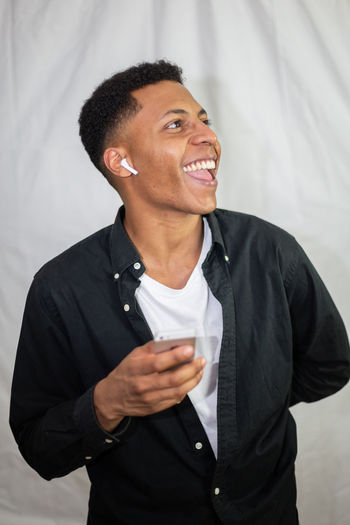 Smiling young man looking away