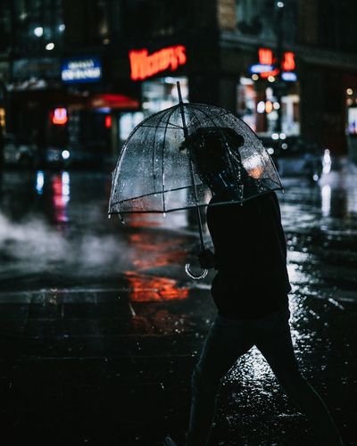 Reflection in city during rainy season at night