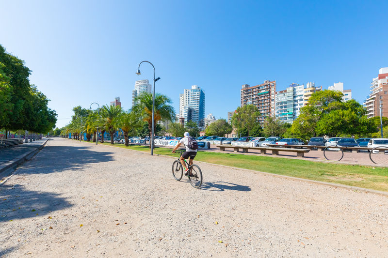 Argentina rosario, a cyclist runs along the track of the river park of southern rosario. 