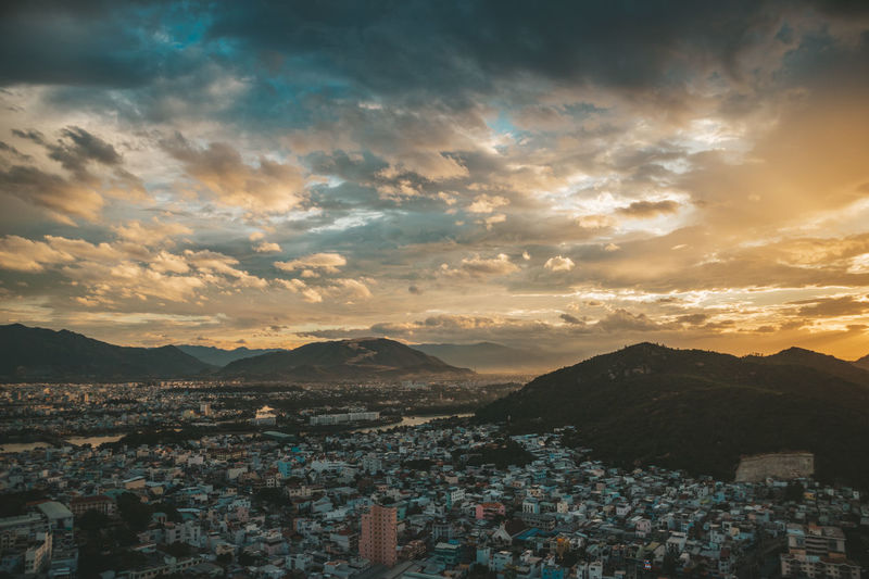 Aerial view of townscape against sky during sunset