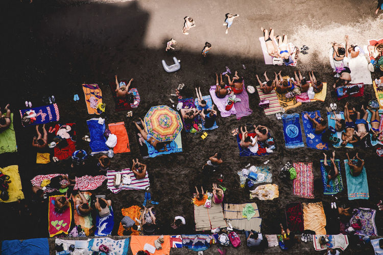 High angle view of people relaxing at beach