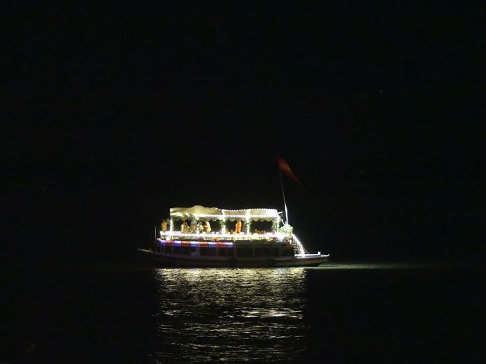 Ship sailing in sea at night