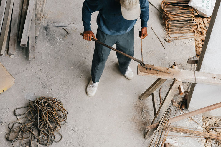 Low section of man working at construction site