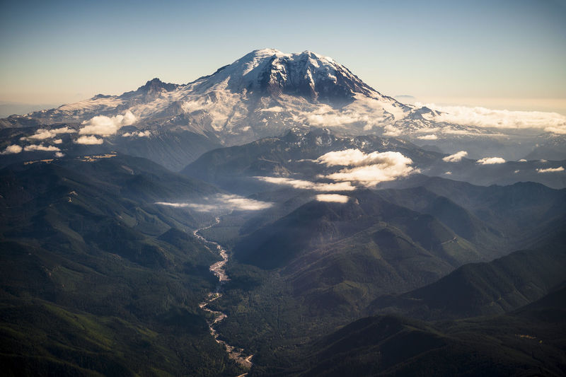 Mount rainier from a plane window with dramatic light
