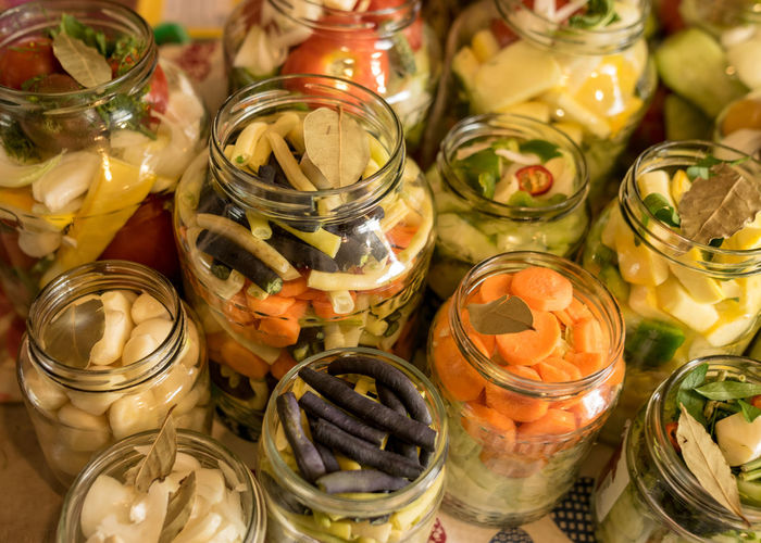 Glass jars with various vegetables, canned vegetables, salting various vegetables in glass jars 