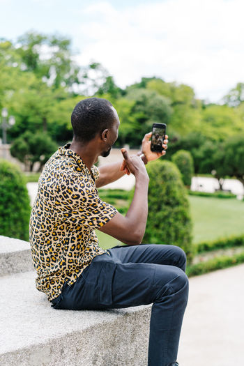 Man photographing with mobile phone