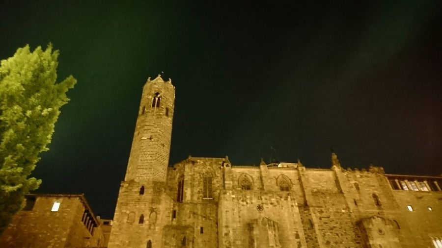 Low angle view of old building against sky at night