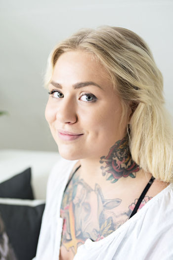 Young woman with tattoos