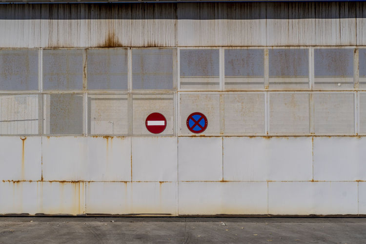 Industrial metal door with access prohibition signs