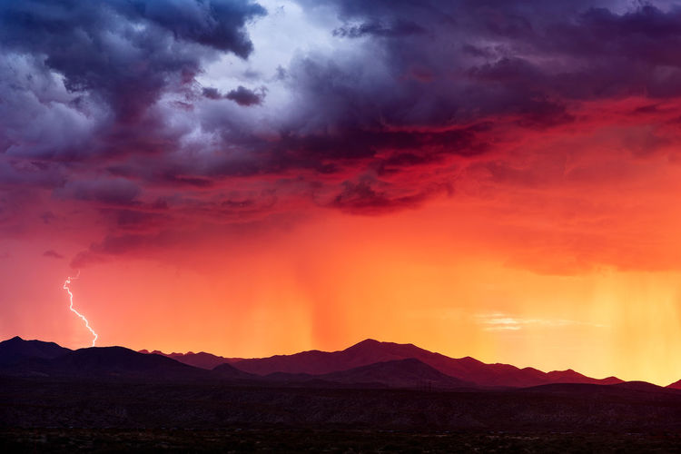 Sunset light illuminates a monsoon thunderstorm near tucson, arizona.