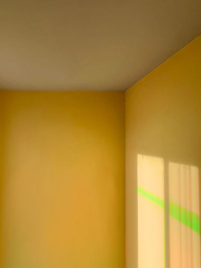 Close-up of yellow wall in house