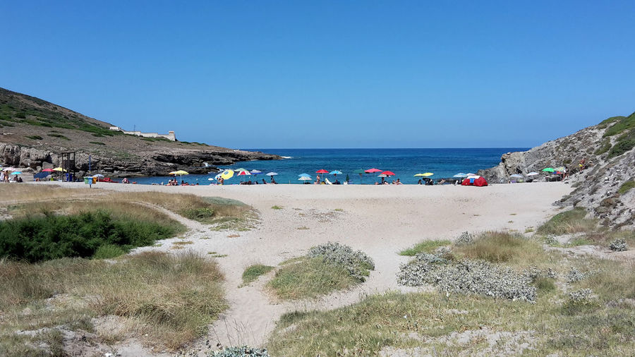 Scenic view of beach against clear sky