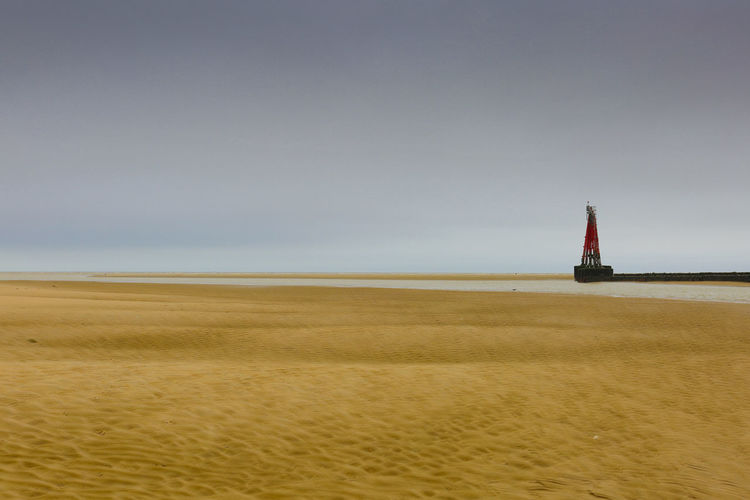 Blurred image of lighthouse against sky