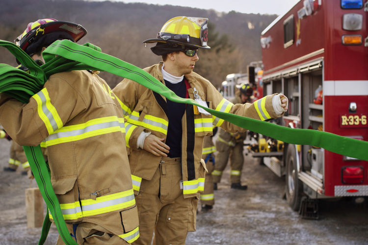 Firefighters working at field