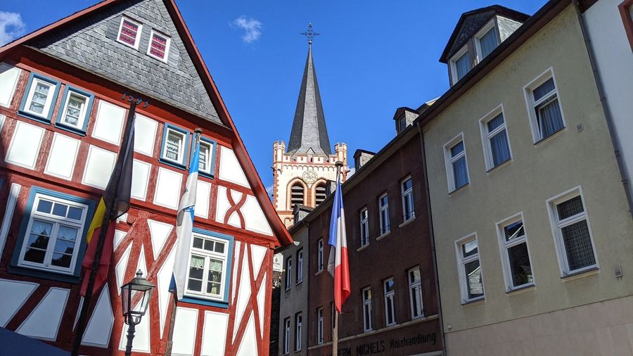 Low angle view of buildings against blue sky