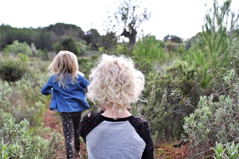 Rear view of child walking