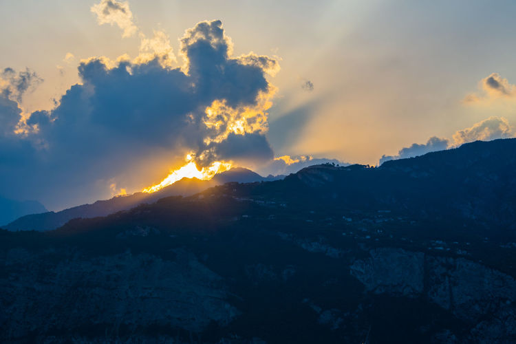Scenic view of mountains against dramatic sky