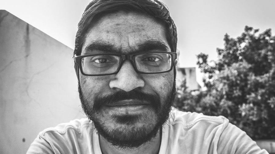 Portrait of man wearing eyeglasses