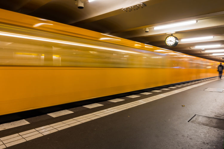 Blurred motion of train at illuminated berlin u-bahn
