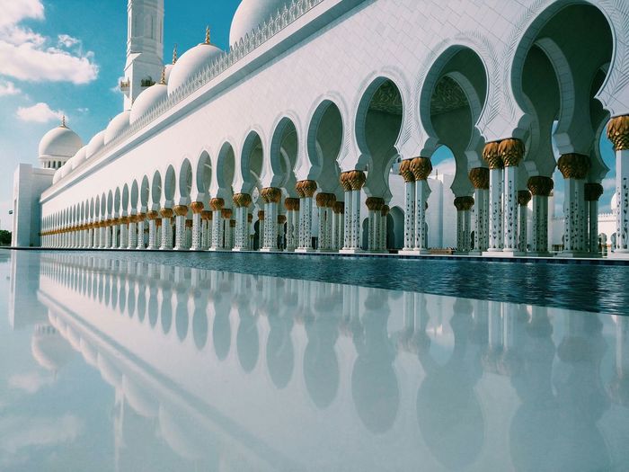 Colonnade in sheikh zayed mosque on sunny day