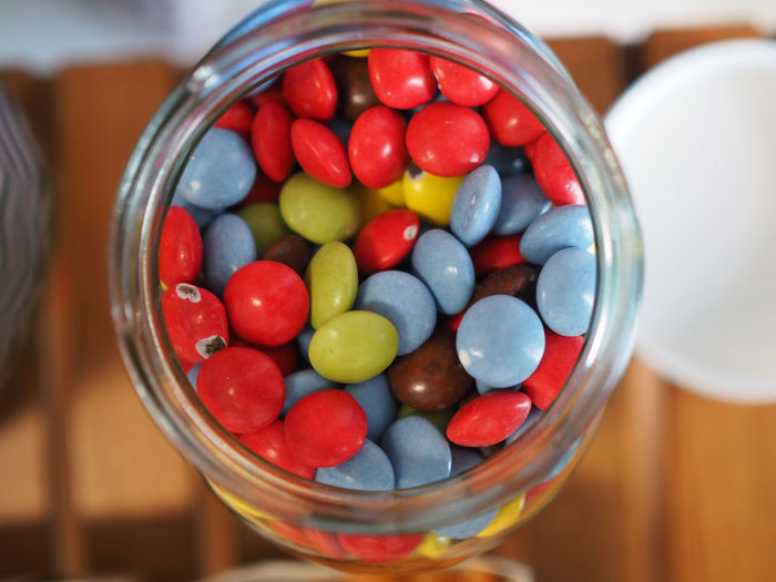 Close-up of candy in jar on table