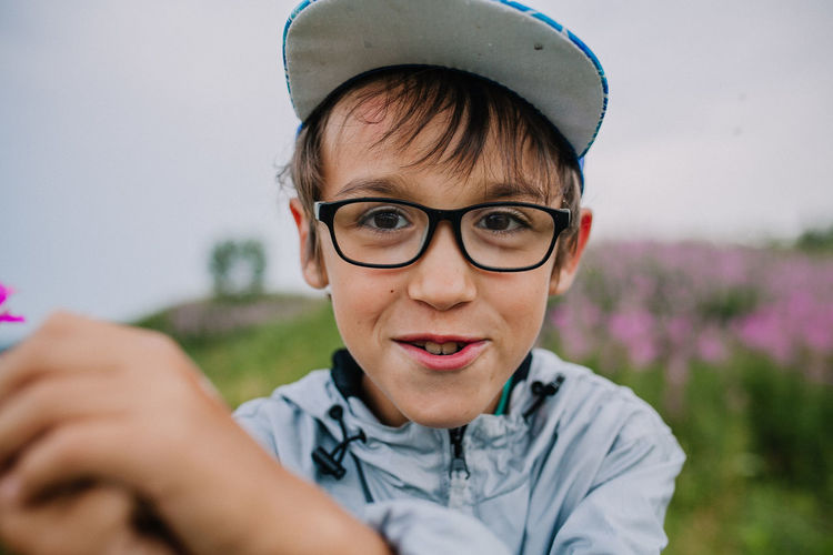 Portrait of boy smiling boy standing outdoors