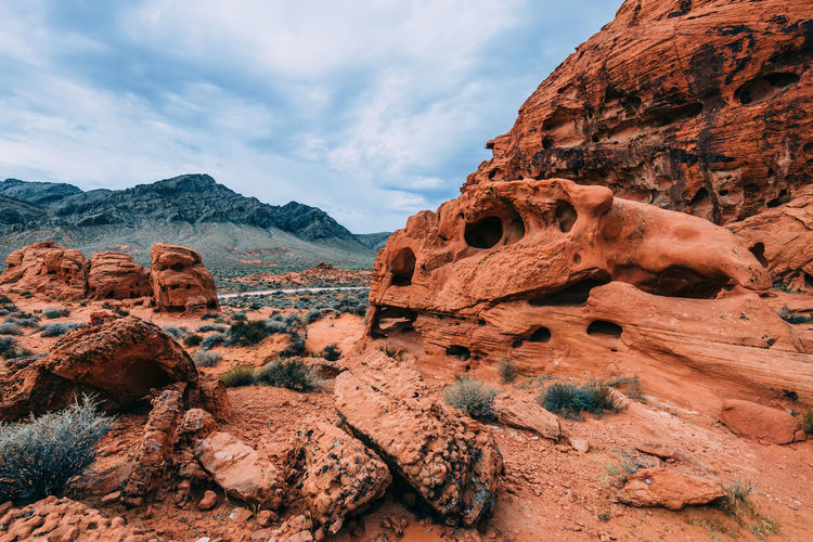 Low angle view of rock formations against sky