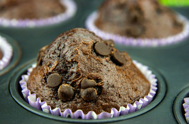 Close-up of chocolate chip muffins in tray