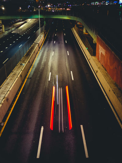 High angle view of traffic lights on road at night