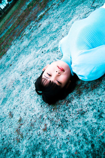 Portrait of a woman lying on the ground