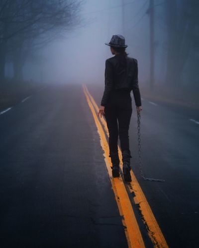 Woman walking on road