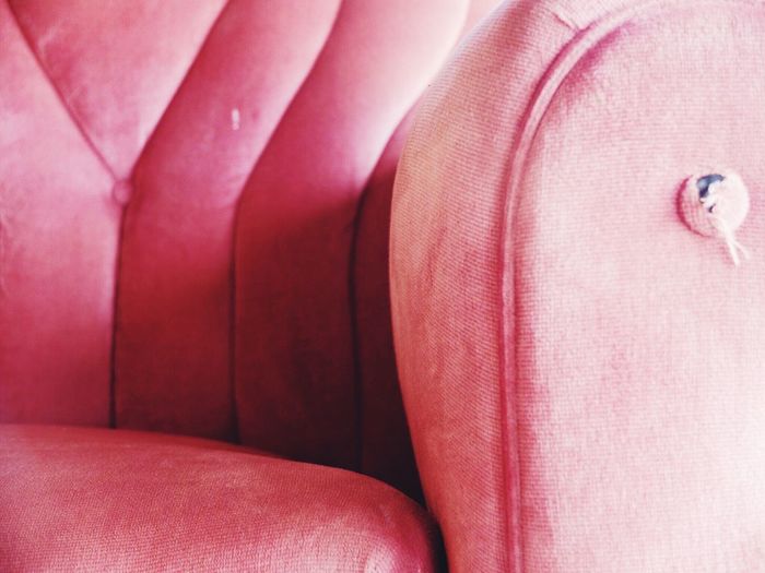 Close-up of empty red sofa