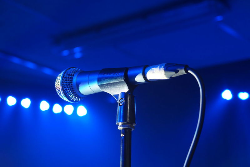 Midsection of microphone on stage