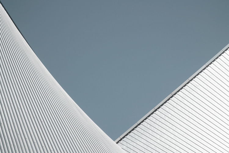 Low angle view of modern building against clear sky