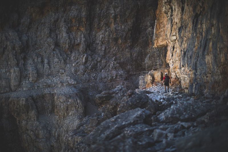 Full length of woman standing in cave