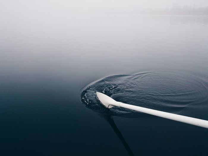 Cropped image of white oar in lake