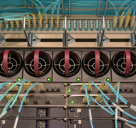 Fiber optic network connections on a server blade system enclosure in a data center