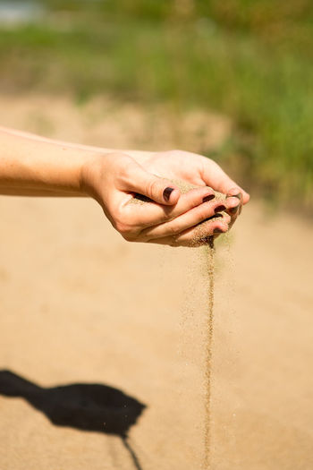 Person hand holding sand