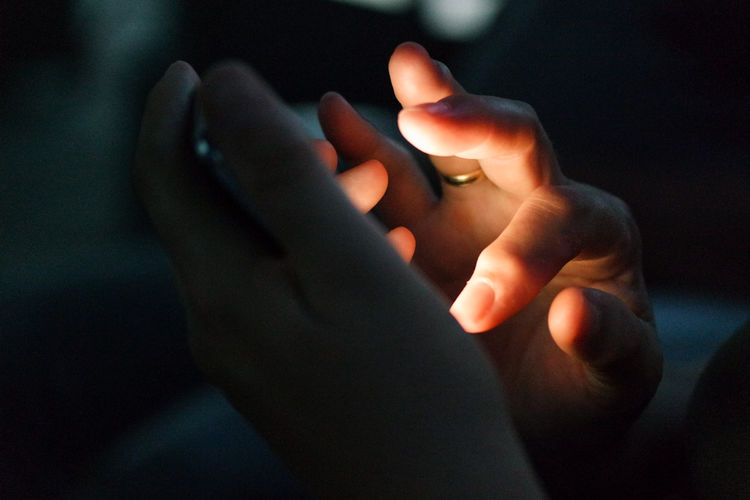 Close-up of hands using smart phone