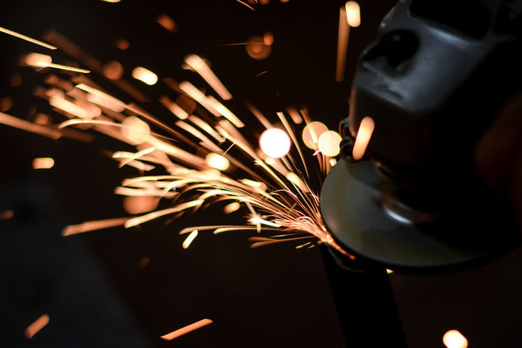 Close-up of welder working in factory