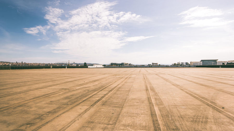 Panoramic view of airport runway against sky