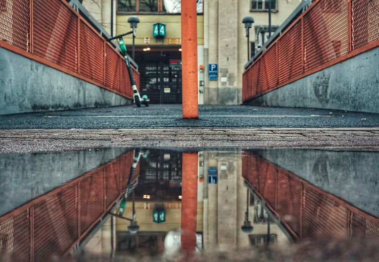 Reflection of building in puddle