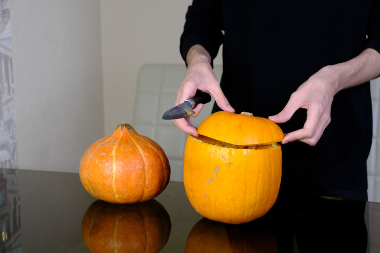 Low angle view of pumpkins on orange pumpkin