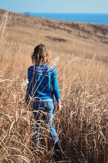 Woman walking on field