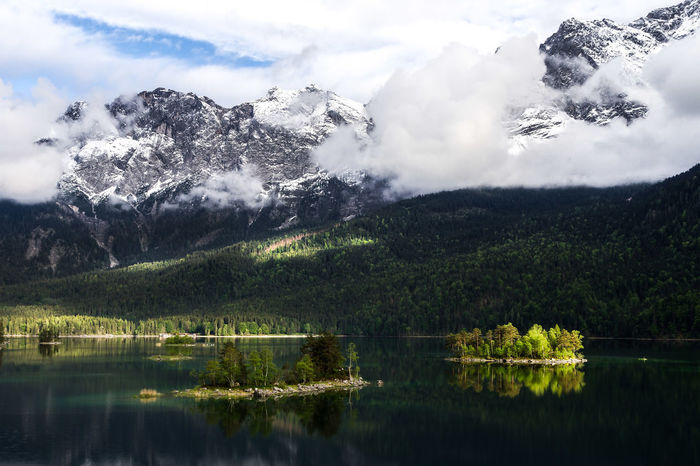 Scenic view of eibsee lake by mountains