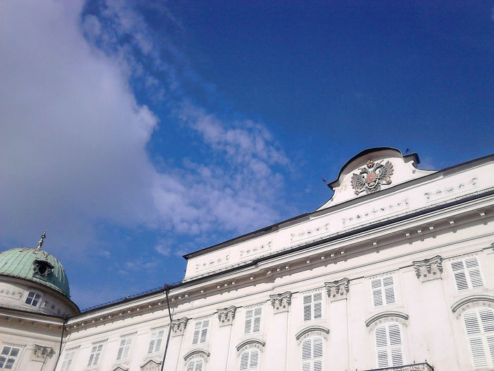Low angle view of hofburg palace against sky